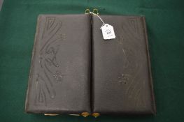 An unusual Victorian double photograph album with contents.