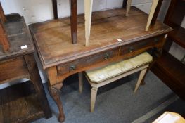 A Georgian style walnut two drawer side table.
