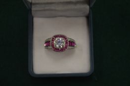 A good decorative silver dress ring, the centre set with a Moissanite measuring 7mm in diameter,