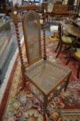 A mahogany chair with cane work back panel and seat.