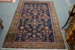 A Persian style rug, blue ground with stylised decoration, 198cm x 133cm.