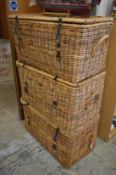 Three large wicker baskets.