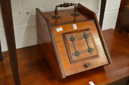 A Victorian walnut coal box.