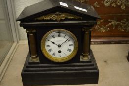 A Victorian slate mantel clock.