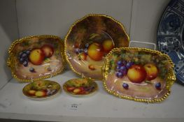 A group of five items of Worcester fruit decorated porcelain to include a pair of dishes, a plate