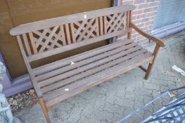 A modern hardwood garden bench.