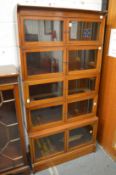 A good mahogany and inlaid five section standing bookcase, each section with pair of glazed doors.
