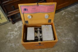 A boxed set of baby weighing scales.