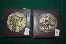 Two Olympic medallions with original cases, one engraved for 1949.