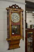 A 19th century marquetry inlaid wall clock.