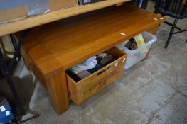 An oak two-tier coffee table.