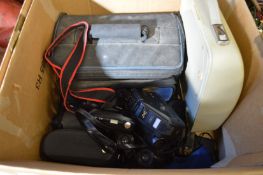 Camera equipment, binoculars and a portable typewriter.