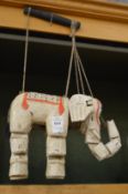 An elephant puppet.