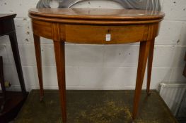 A mahogany demi-lune fold-over tea table.