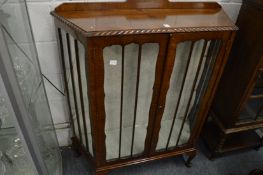 A mahogany display cabinet.