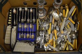 Quantity of flatware and a pair of candlesticks.