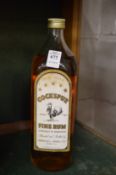 A bottle of Cockspur rum.