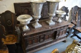 An unusual Continental oak cassone with double rising top, small door to the front revealing small