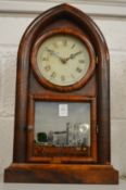 A lancet shaped mantel clock, the pictorial door depicting Westminster Abbey.