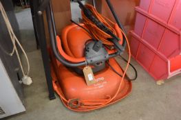 A Flymo electric lawn mower.