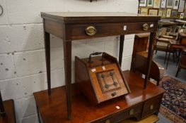 A mahogany rectangular fold-over tea table with a single long drawer.