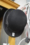 A bowler hat, internal measurements 7.5in (19cm) x 6.25in (15.5cm).
