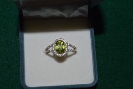 A silver ring set with a 1.1ct natural peridot, with certificate.