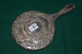 A silver backed dressing table mirror.