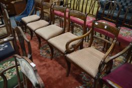 A Regency mahogany dining chair with arms together with two pairs of similar chairs.