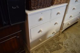 A painted pine chest of drawers.