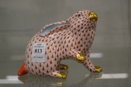 A Herend red fish scale rabbit.