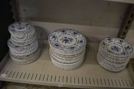A quantity of Johnson Brothers Indies plates and bowls.