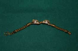 A gilded double head panther bracelet.