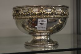A plated pedestal bowl.