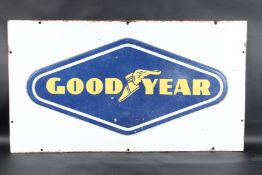 A LARGE VINTAGE GOODYEAR ENAMEL SIGN with the iconic Goodyear and winged foot symbol. 65cms x