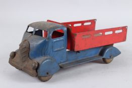 A TIN PLATE TIPPER TRUCK. 30cms long.