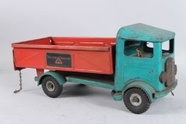 A LARGE TRI-ANG RED AND GREEN TIP UP TRANSPORT TRUCK. 46cms long.