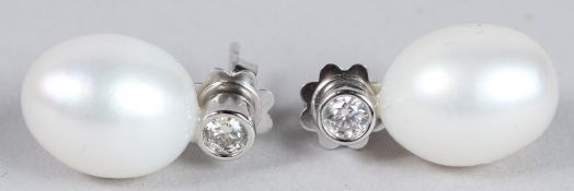 A PAIR OF 18CT WHITE GOLD PEARL AND DIAMOND EARRINGS.