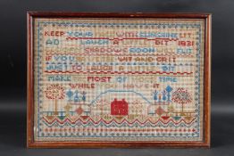 A FRAMED NEEDLEWORK SAMPLER 1931. 12ins x 17ins.