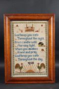 A FRAMED NEEDLEWORK SAMPLER 1922. 14ins x 9ins.