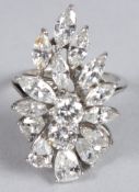A VERY GOOD 18CT WHITE GOLD FLORAL DIAMOND RING set with sixteen diamonds. Ring size M/N.
