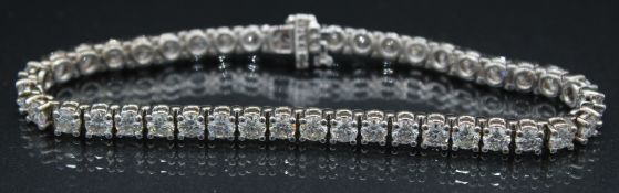 A VERY GOOD 18CT WHITE GOLD AND DIAMOND SET LINE BRACELET with forty two diamonds. 17grams, 8ins
