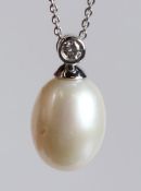 AN 18CT WHITE GOLD, PEARL AND DIAMOND PENDANT AND CHAIN.