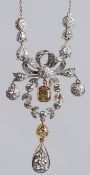 A GOOD 18CT WHITE GOLD, DIAMOND AND YELLOW DIAMOND FLORAL SPRAY PENDANT.