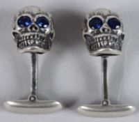 A PAIR OF STERLING SILVER SKULL CUFFLINKS.