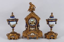 A 19TH CENTURY FRENCH LOUIS XVITH STYLE GILT METAL AND PORCELAIN THREE-PIECE CLOCK GARNITURE. The