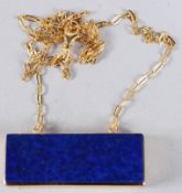 A SILVER GILT LAPIS PENDANT AND CHAIN.