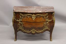 A VERY GOOD LOUIS XVI KINGWOOD AND MARQUETRY BOMBE COMMODE with marble top, two deep drawers with