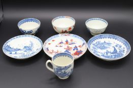 TWO TEA BOWLS AND SAUCERS AND A TRIO.