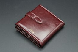 AN ASPREY'S FOLDING LEATHER PHOTO ALBUM.